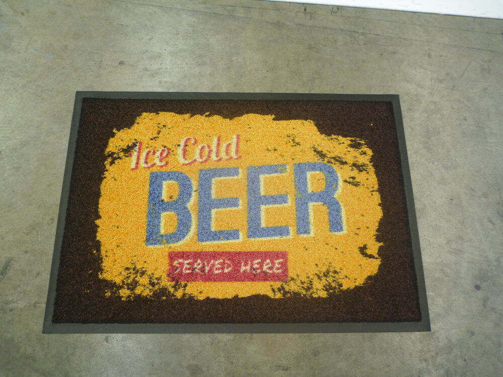 Black bar mat with golden bubbly Beer lettering