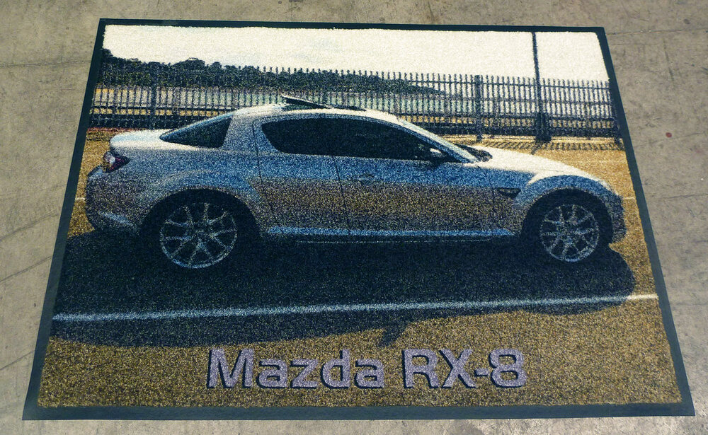 Photo-printed doormat of a white car
