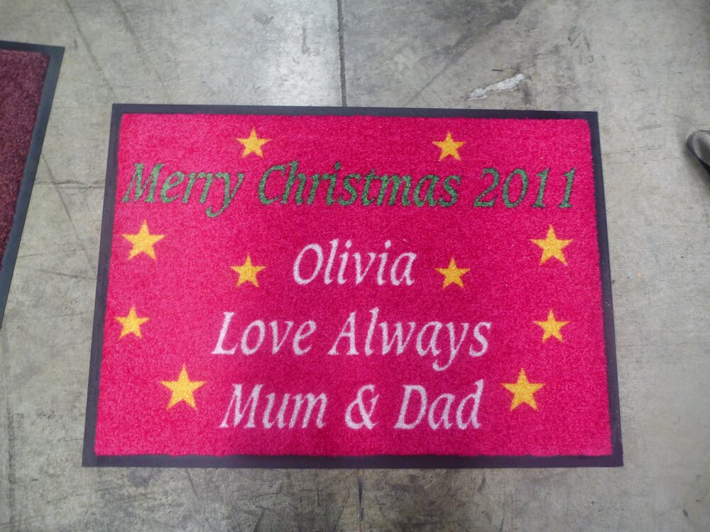 Pink personalised Christmas doormat with gold stars