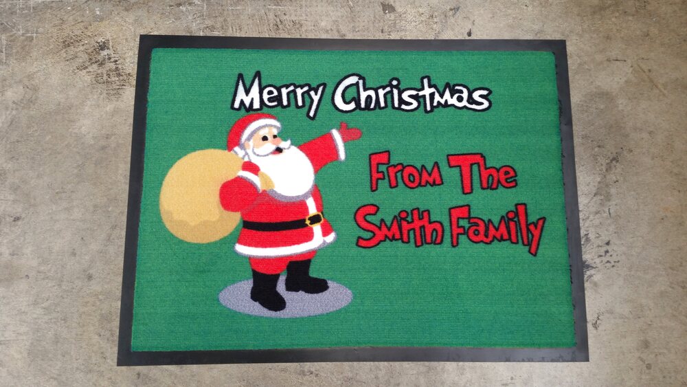 Green Christmas doormat with Santa and a family name
